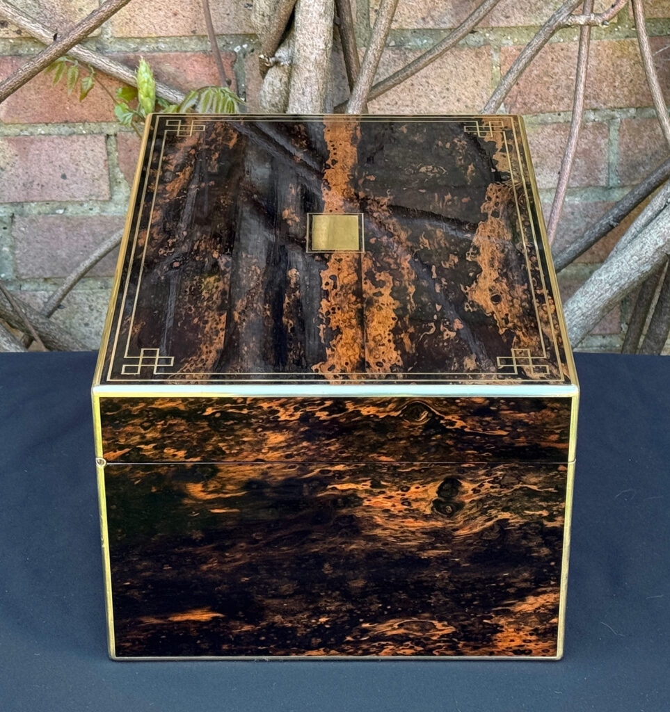 Left side view of an antique jewellery box in coromandel, by William Lund.