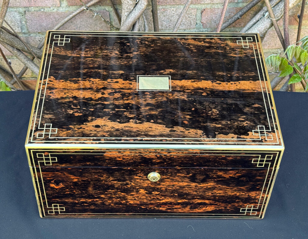 Overhead view of an antique jewellery box in coromandel, by William Lund.