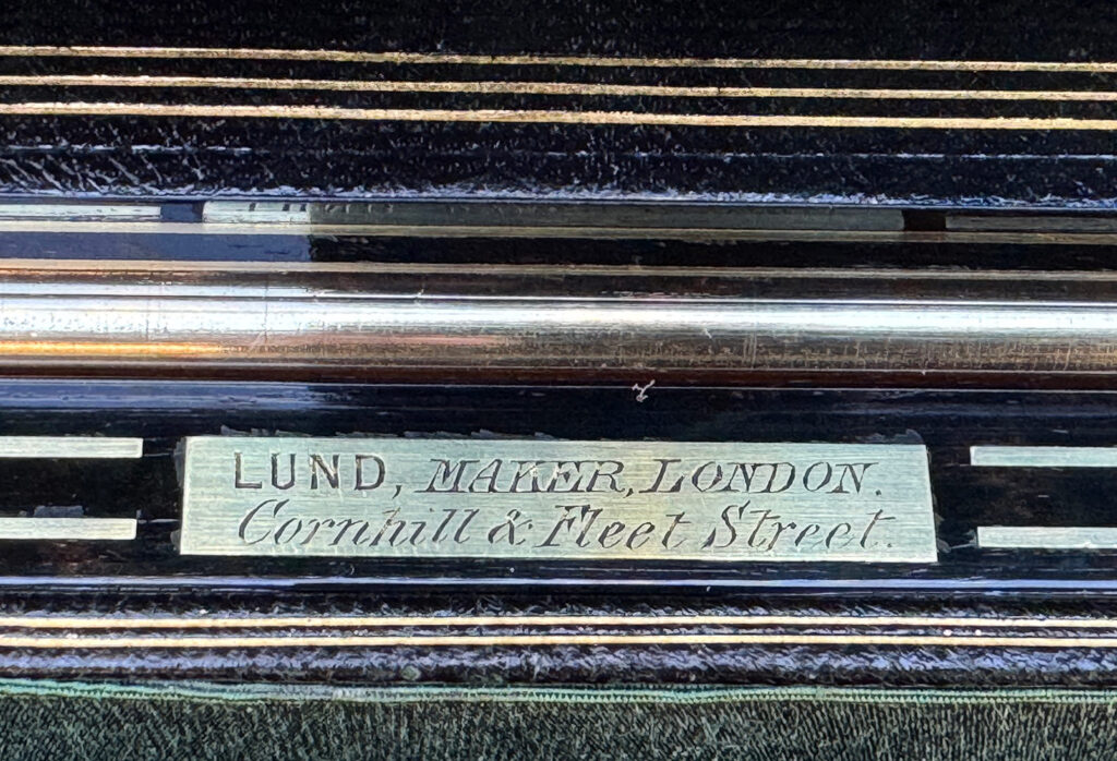 Brass plate engraved with William Lund's manufacturer mark.