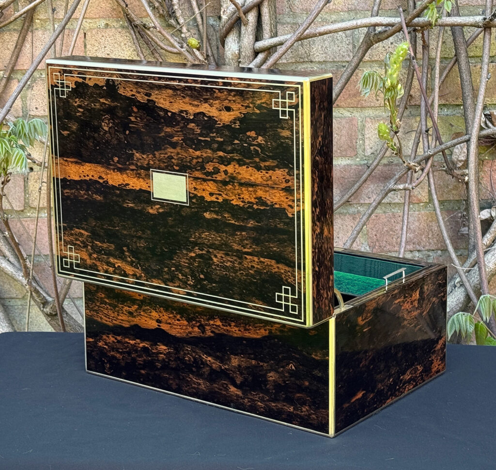 Rear opened view of an antique jewellery box in coromandel, by William Lund.
