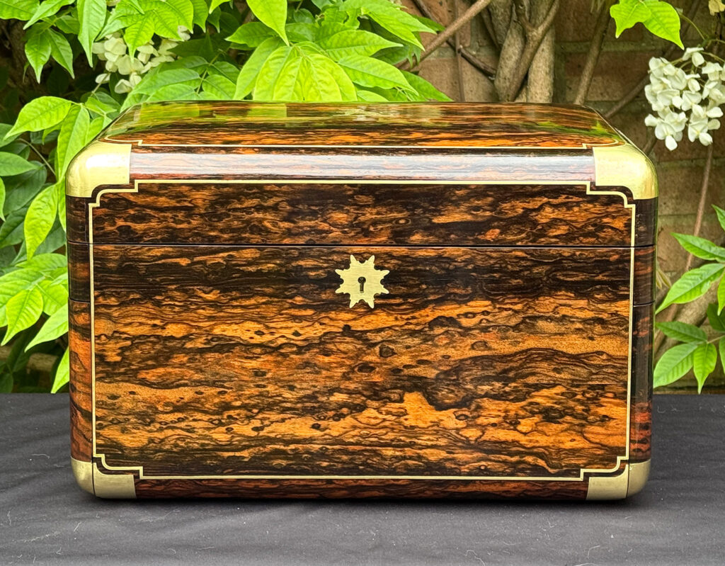 Front view of an extra large antique jewellery box in coromandel with Betjemann Patent 'automatic' mechanism, by Leuchars.