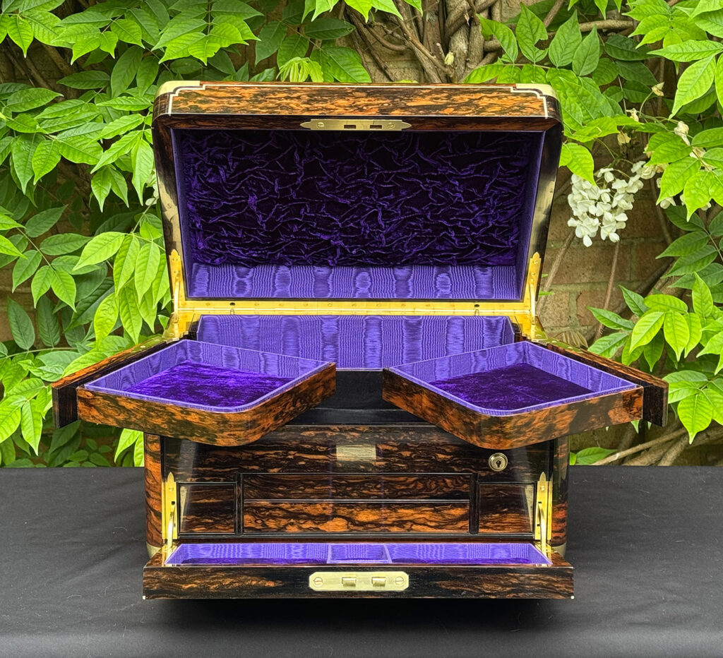 Front semi-opened interior view of an extra large antique jewellery box in coromandel with Betjemann Patent 'automatic' mechanism, by Leuchars.