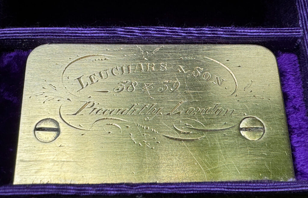 Engraved brass retailer's plate belonging to William Leuchars.