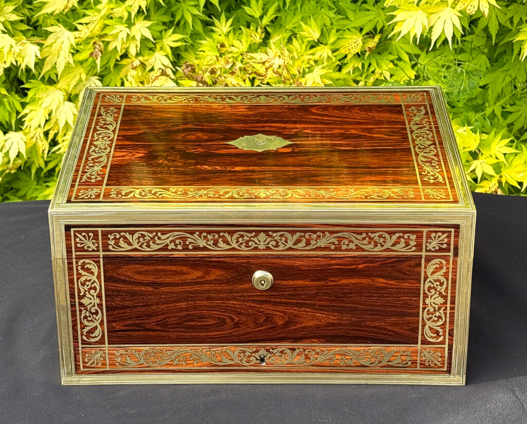 Front view of an antique jewellery box in kingwood, by Wells & Lambe.
