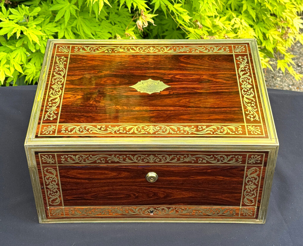 Overhead view of an antique jewellery box in kingwood, by Wells & Lambe.