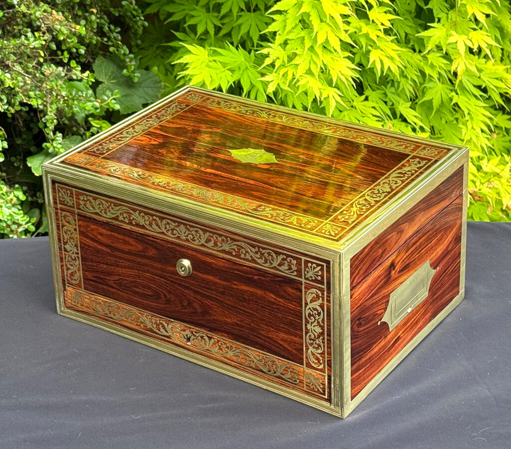 Front right view of an antique jewellery box in kingwood, by Wells & Lambe.