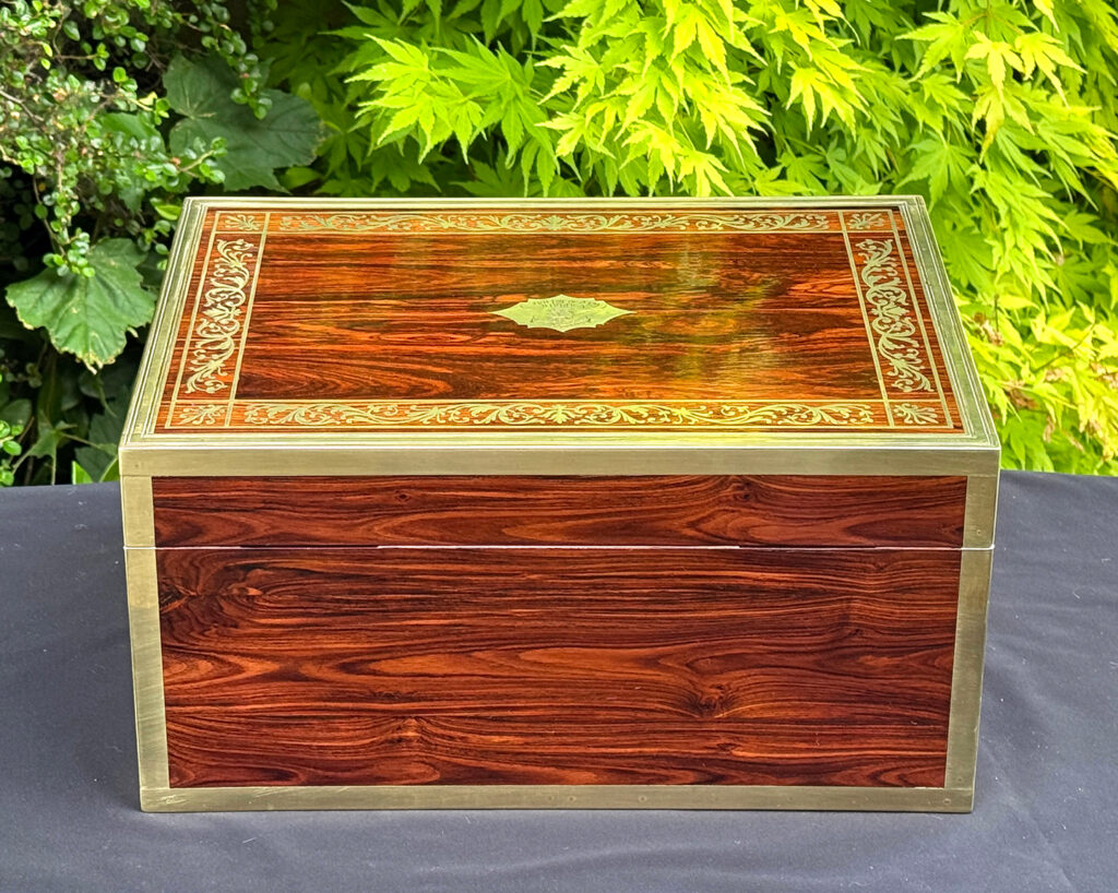 Rear view of an antique jewellery box in kingwood, by Wells & Lambe.