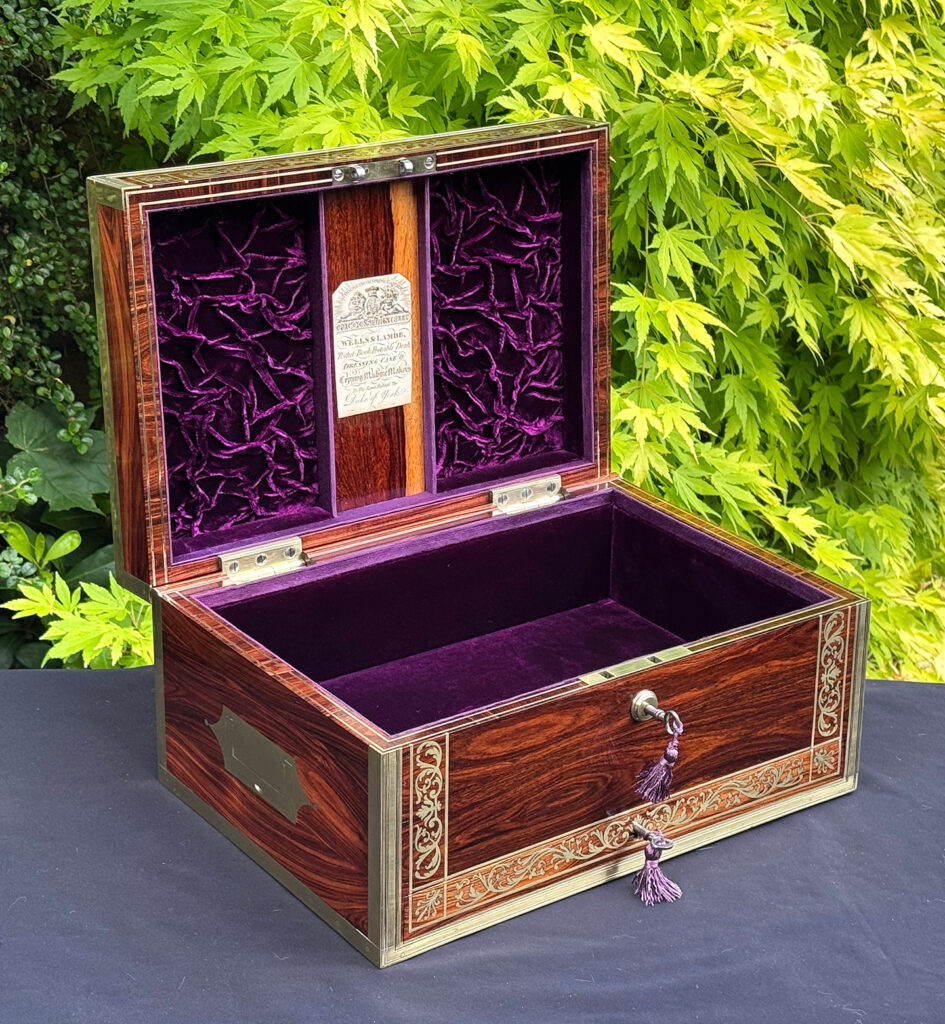 Front left interior view of an antique jewellery box in kingwood, by Wells & Lambe.