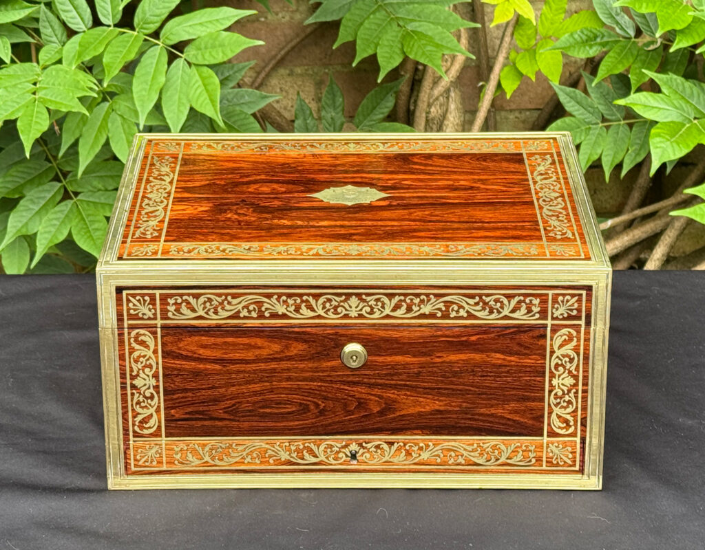 Front view of an antique jewellery box in kingwood, by Wells & Lambe.