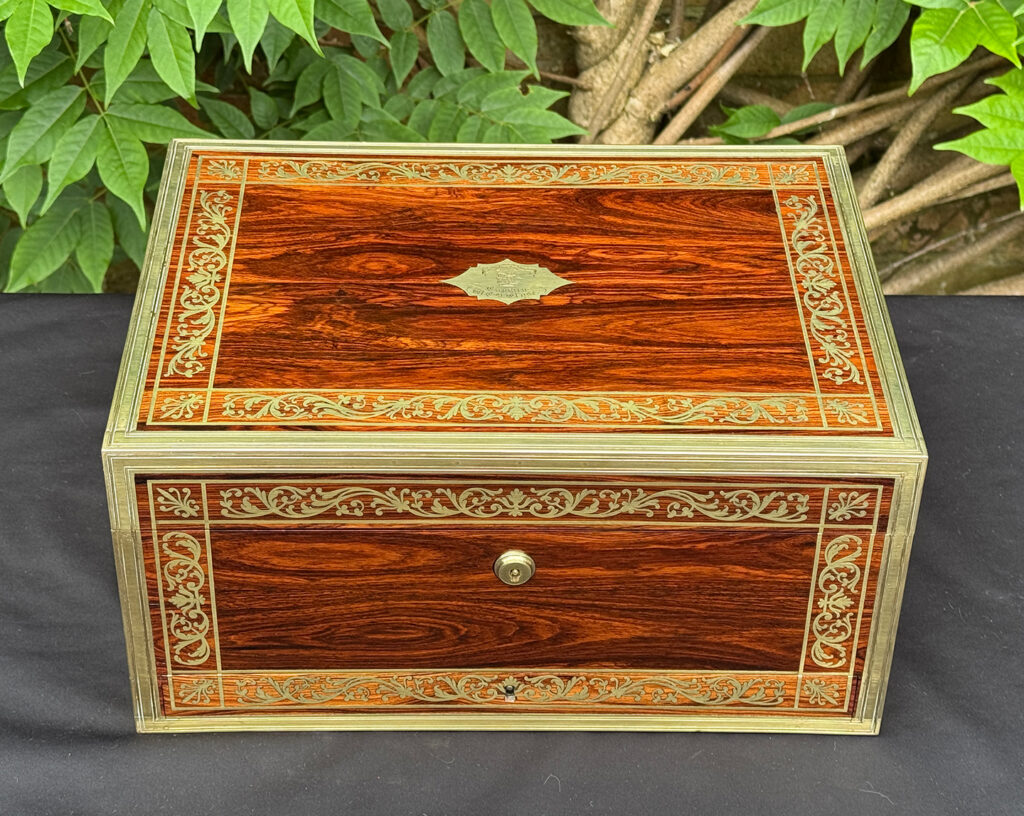 Overhead view of an antique jewellery box in kingwood, by Wells & Lambe.