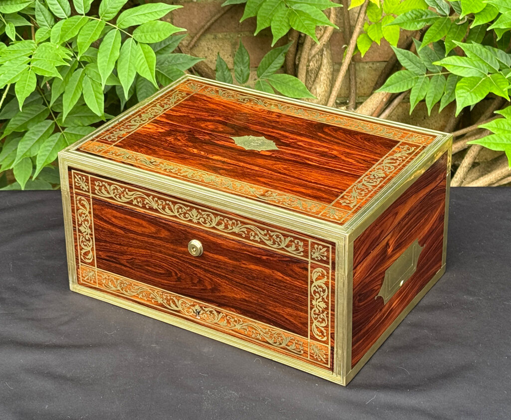 Front right view of an antique jewellery box in kingwood, by Wells & Lambe.