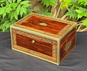 Front right view of an antique jewellery box in kingwood, by Wells & Lambe.