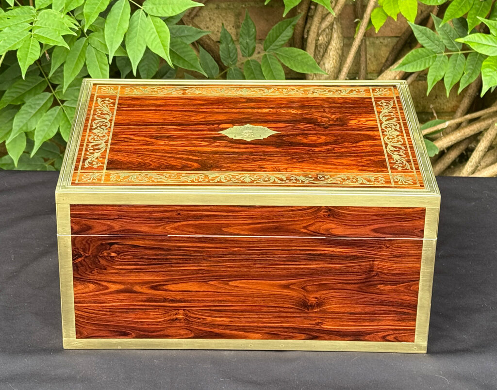 Rear view of an antique jewellery box in kingwood, by Wells & Lambe.