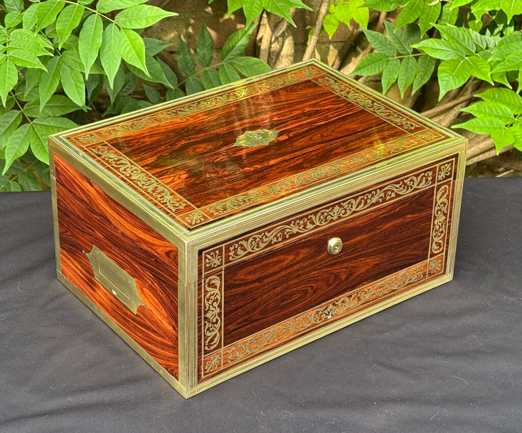 Front left view of an antique jewellery box in kingwood, by Wells & Lambe.