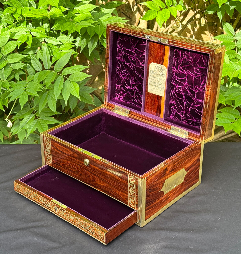 Front right interior view of an antique jewellery box in kingwood, by Wells & Lambe, with lower drawer opened.