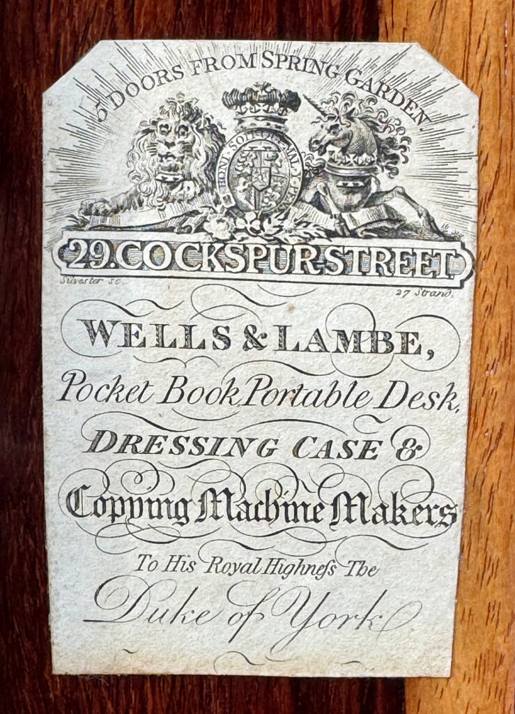 Closer view of a Wells & Lambe paper manufacturers label.