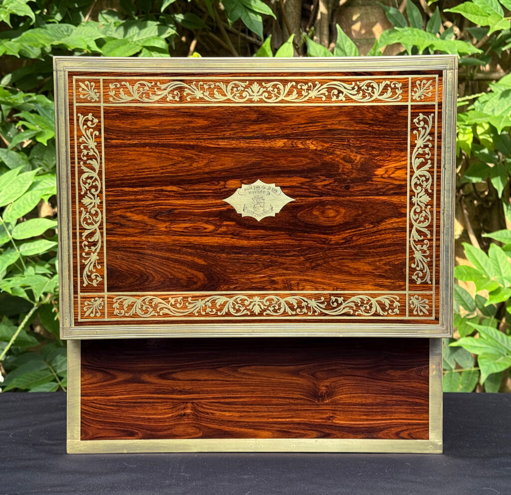 Rear opened view of an antique jewellery box in kingwood, by Wells & Lambe.
