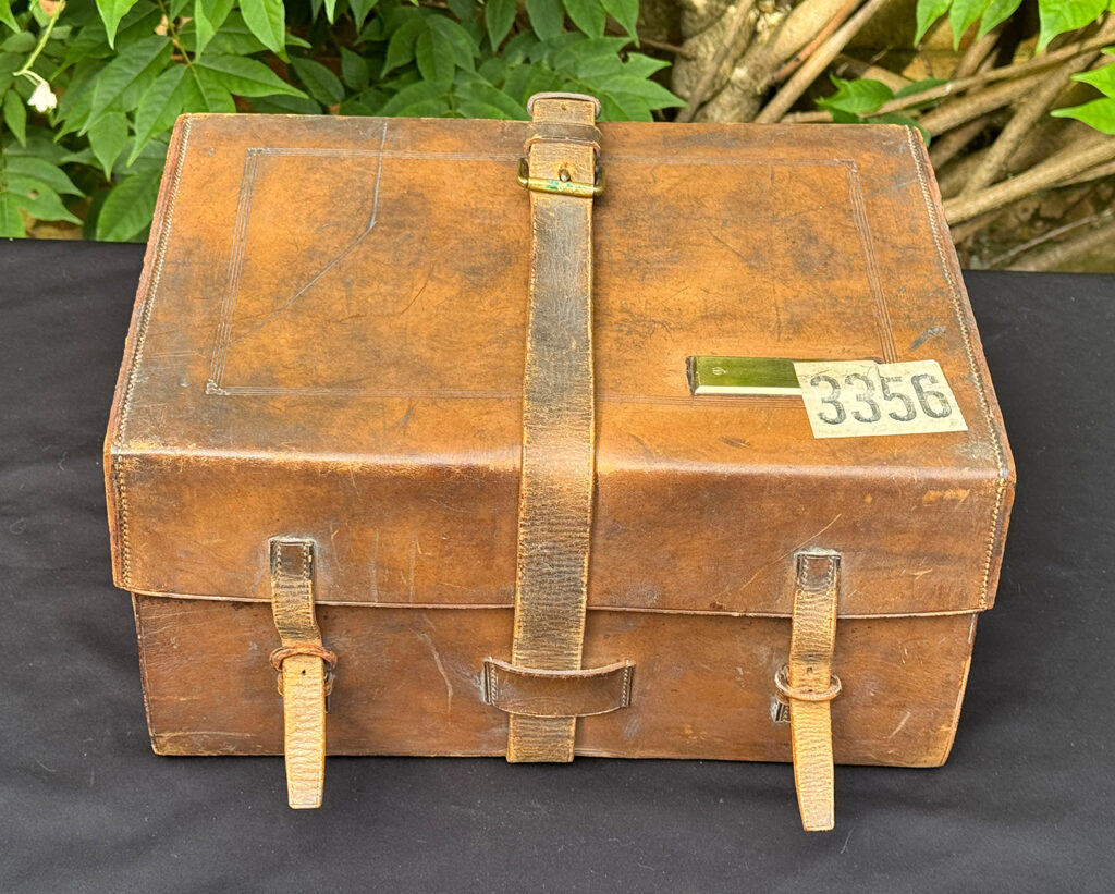 Front view of the outer leather case from an antique jewellery box in kingwood, by Wells & Lambe.