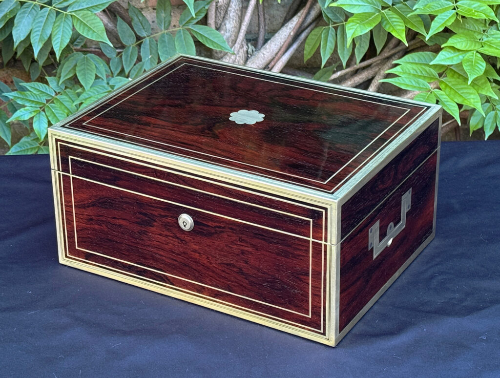 Front right view of a magnificent antique 1814 dressing case in rosewood by David Edwards.