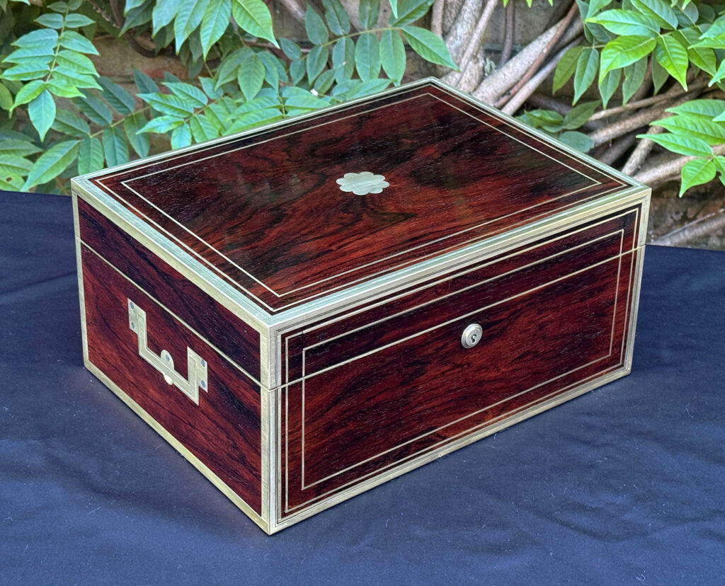 Front left view of a magnificent antique 1814 dressing case in rosewood by David Edwards.