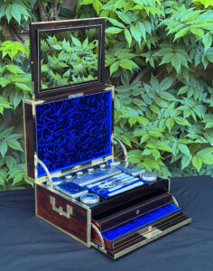 Front left interior view of a magnificent antique 1814 dressing case in rosewood by David Edwards, with mirror fully deployed.