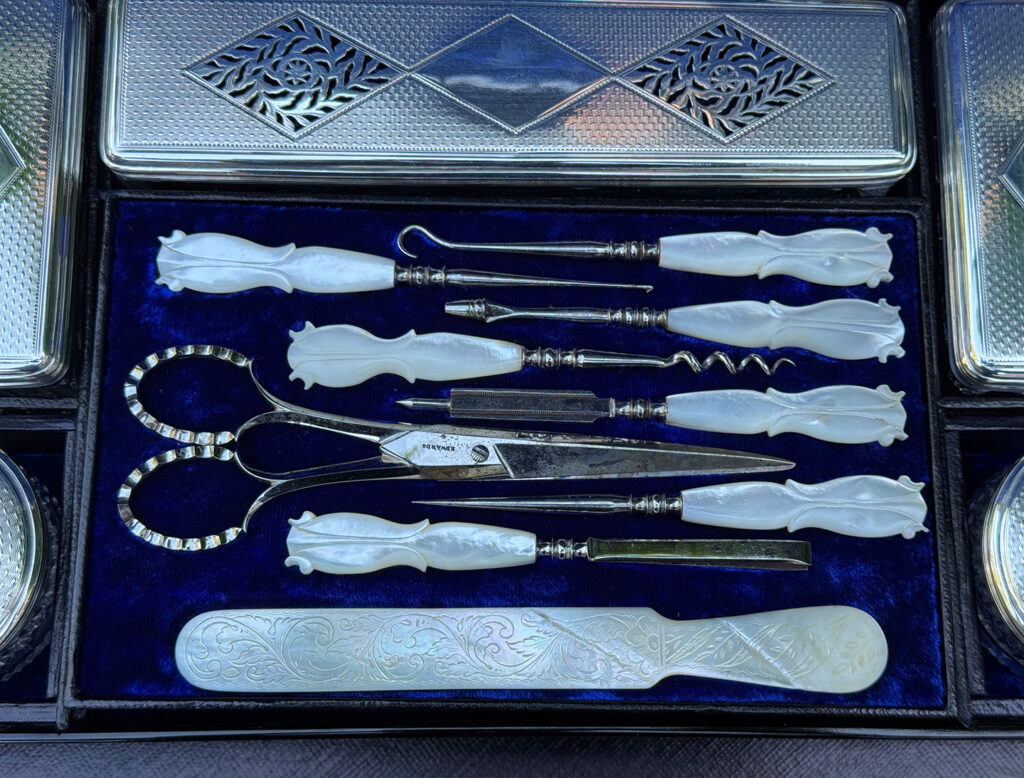 Closeup of the vanity tools from a magnificent antique 1814 dressing case in rosewood by David Edwards.
