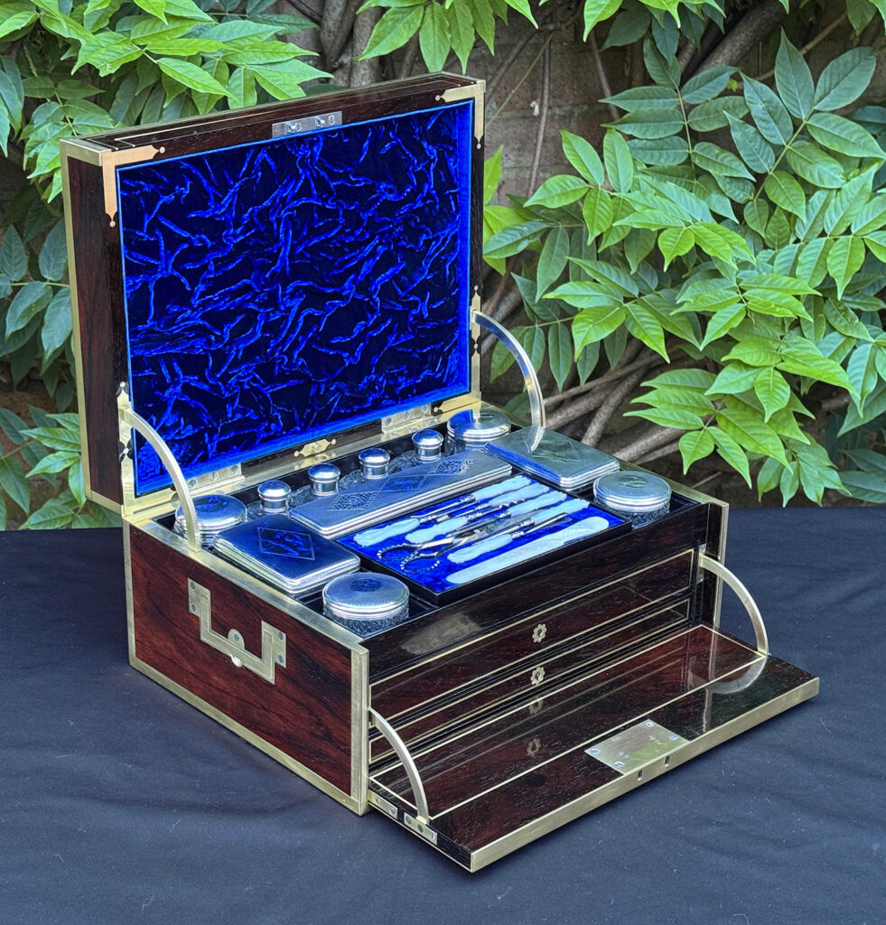 Front left interior view of a magnificent antique 1814 dressing case in rosewood by David Edwards, with front flap opened out.