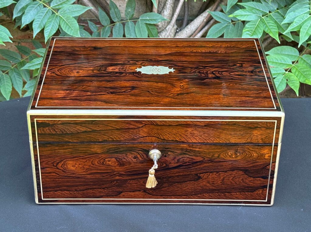 Front view of an antique document box in rosewood with satinwood interior, by Leuchars.
