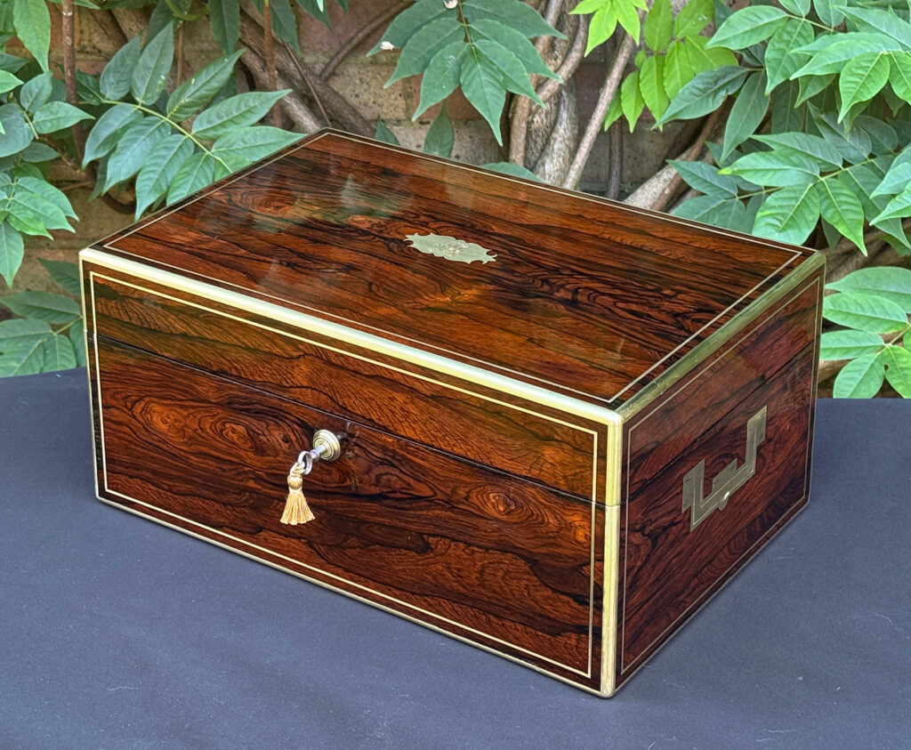 Front right view of an antique document box in rosewood with satinwood interior, by Leuchars.
