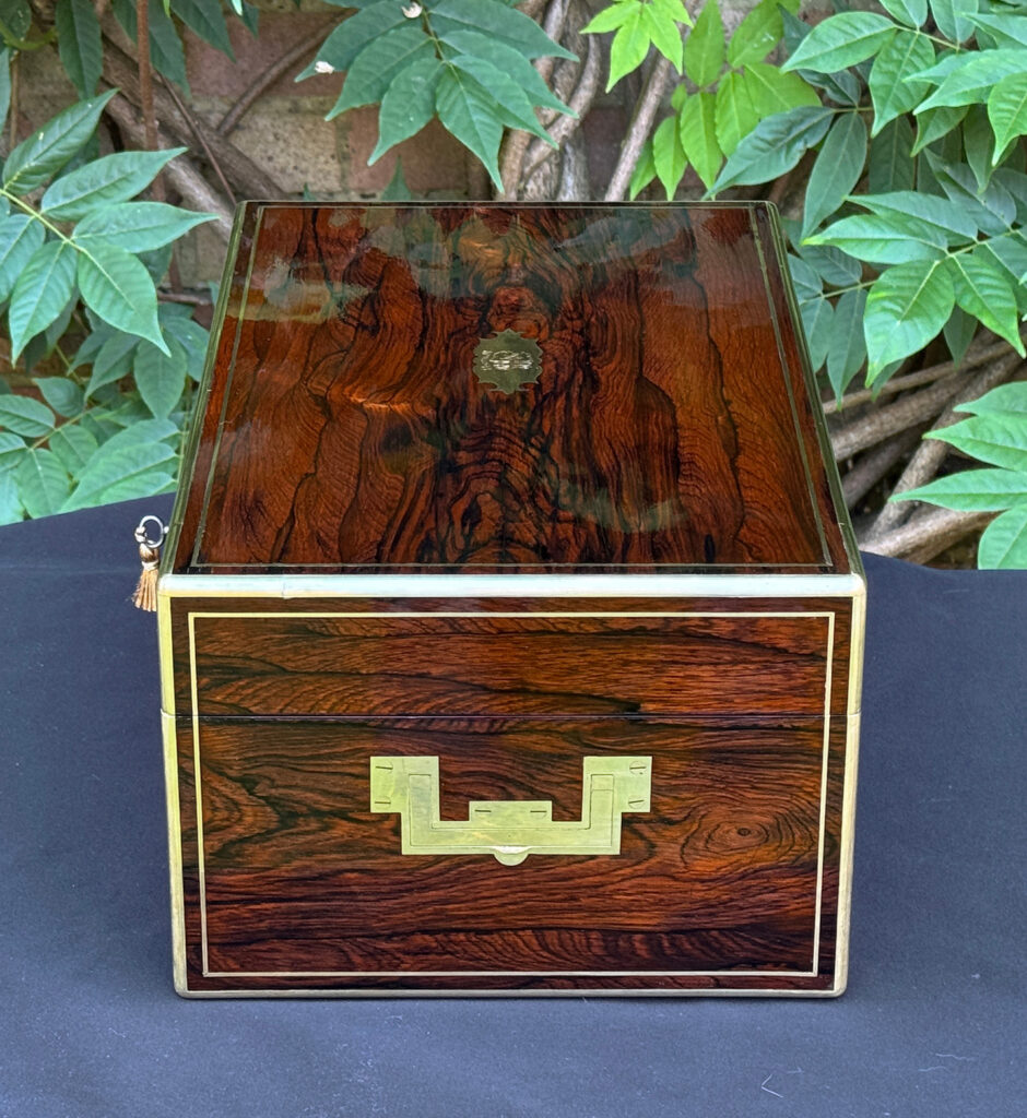 Right side view of an antique document box in rosewood with satinwood interior, by Leuchars.