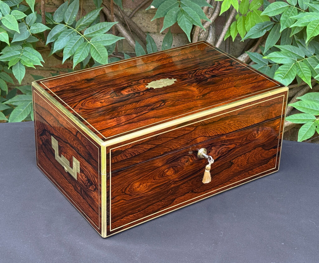Front left view of an antique document box in rosewood with satinwood interior, by Leuchars.