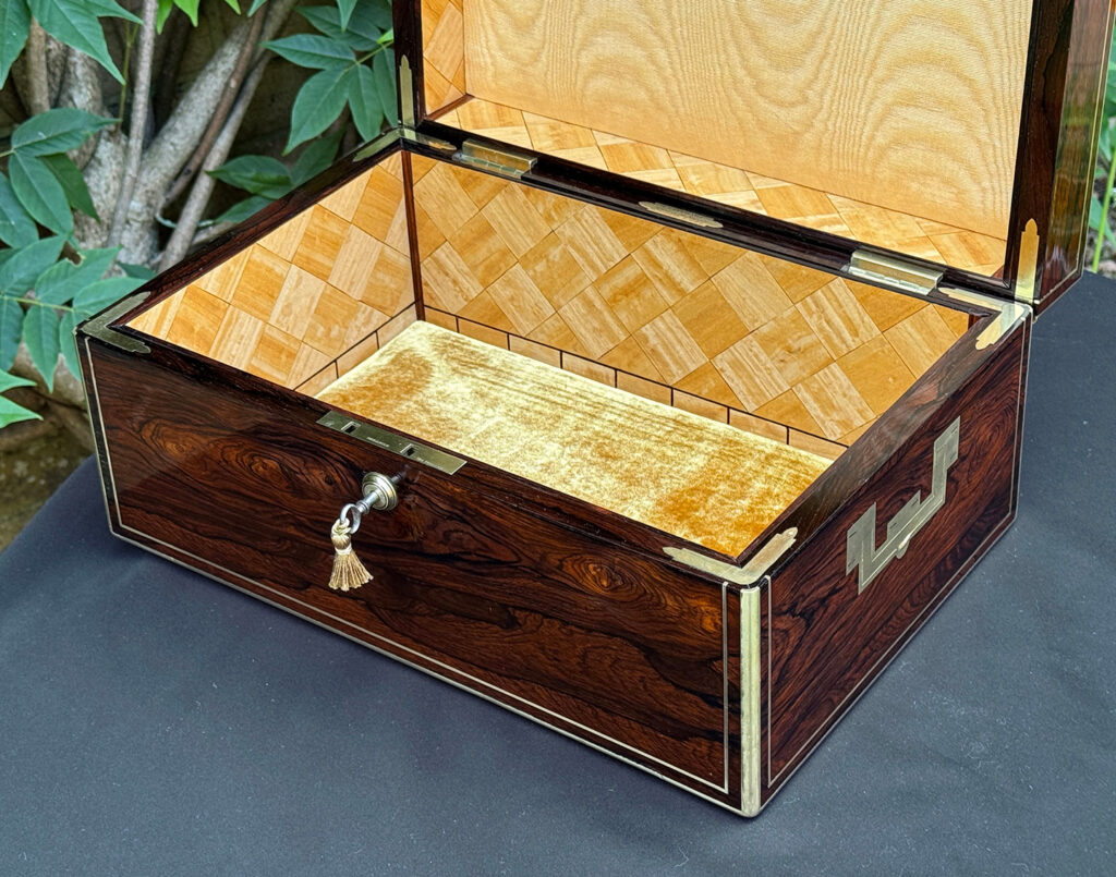 Closer front right interior view of an antique document box in rosewood with satinwood interior, by Leuchars.