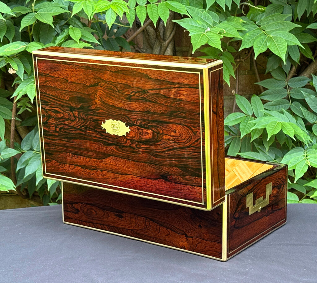 Rear opened view of an antique document box in rosewood with satinwood interior, by Leuchars.