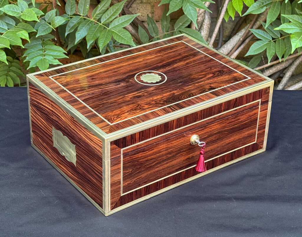 Front left view of an antique jewellery box in kingwood, by David Edwards.