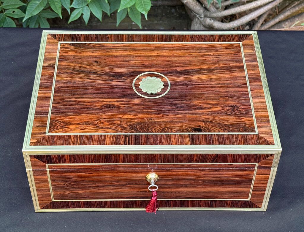 Overhead view of an antique jewellery box in kingwood, by David Edwards.
