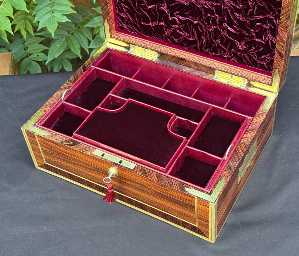 Closer interior view of an antique jewellery box in kingwood, by David Edwards.