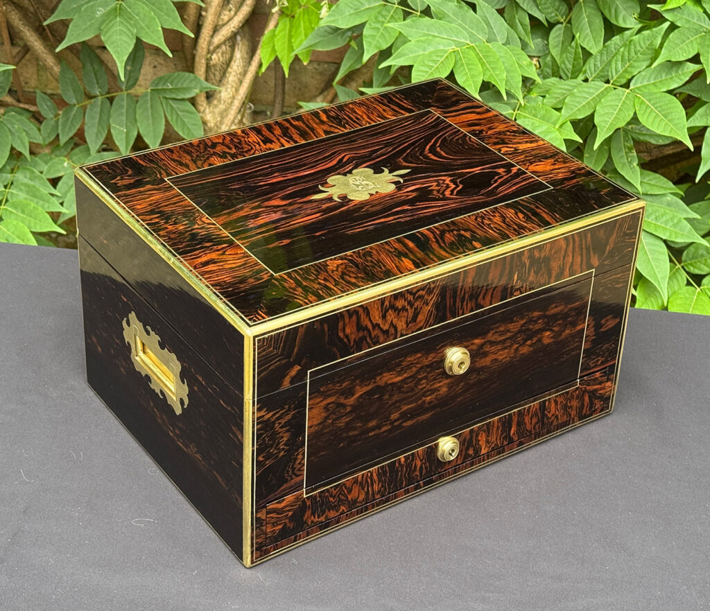 Front left view of an antique jewellery box in calamander.
