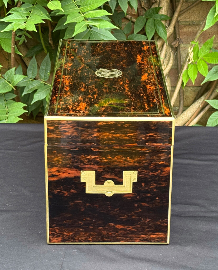 Left side view of an antique jewellery box in coromandel, by William Lund.
