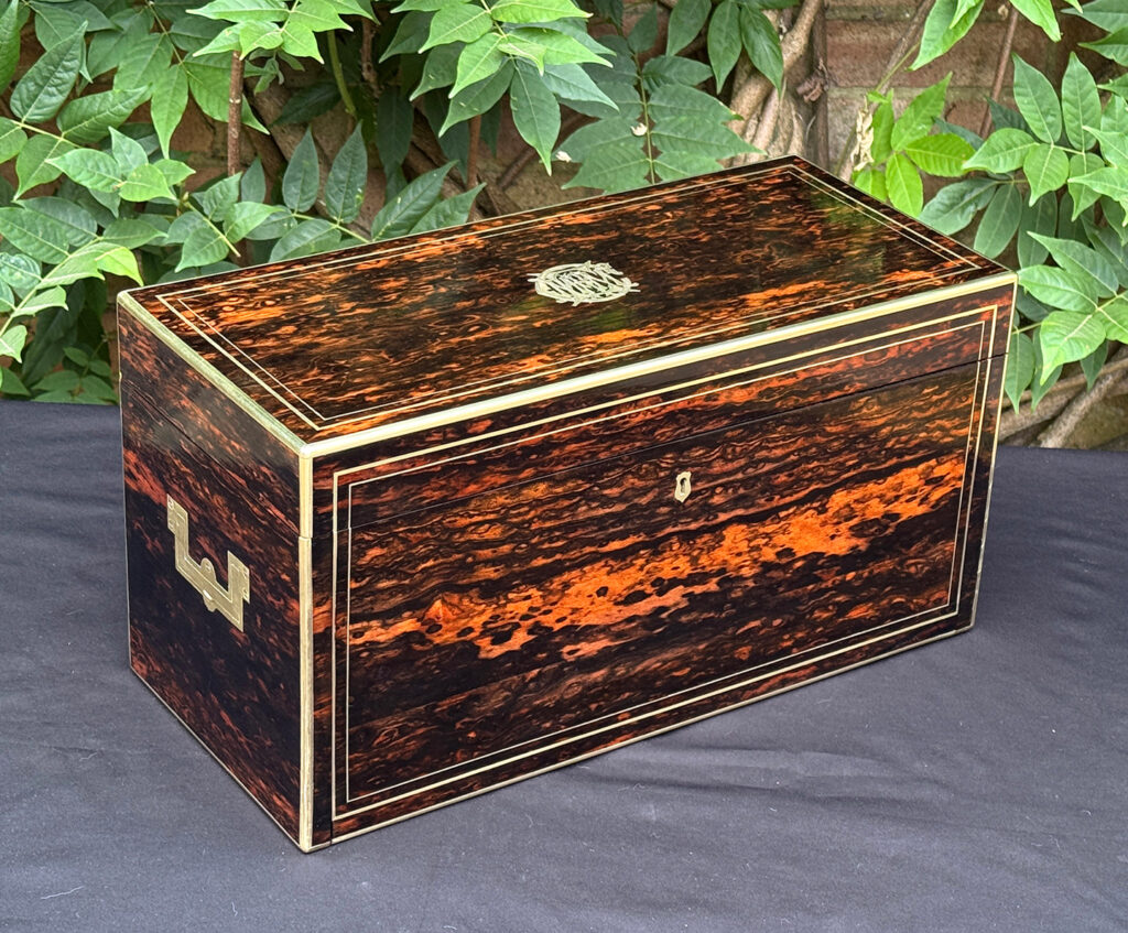Front left view of an antique jewellery box in coromandel, by William Lund.