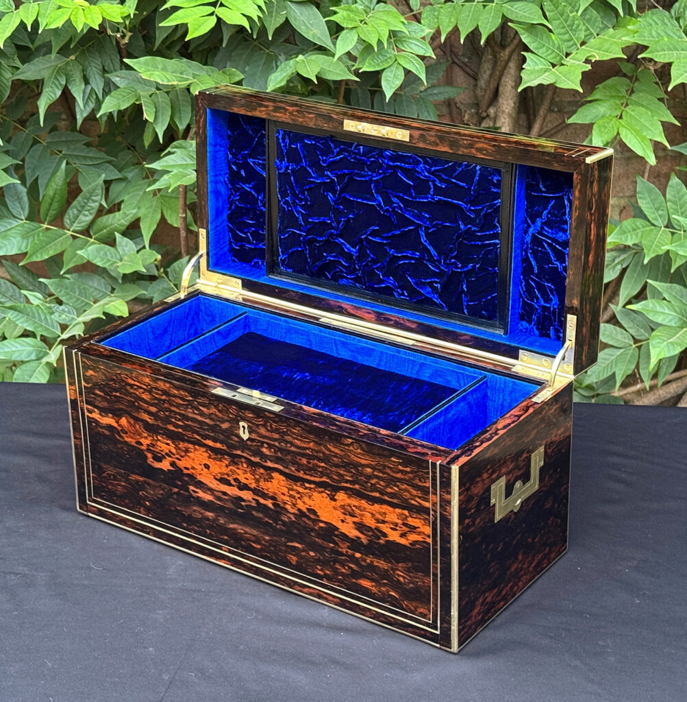 Front right interior view of an antique jewellery box in coromandel, by William Lund.